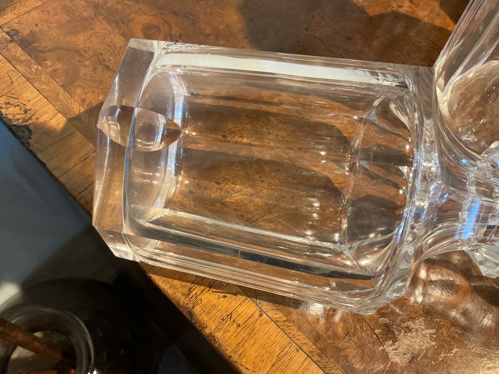 A set of four matching clear cut crystal liqueur decanters featuring panelled bodies and facet-cut stoppers. View VIII