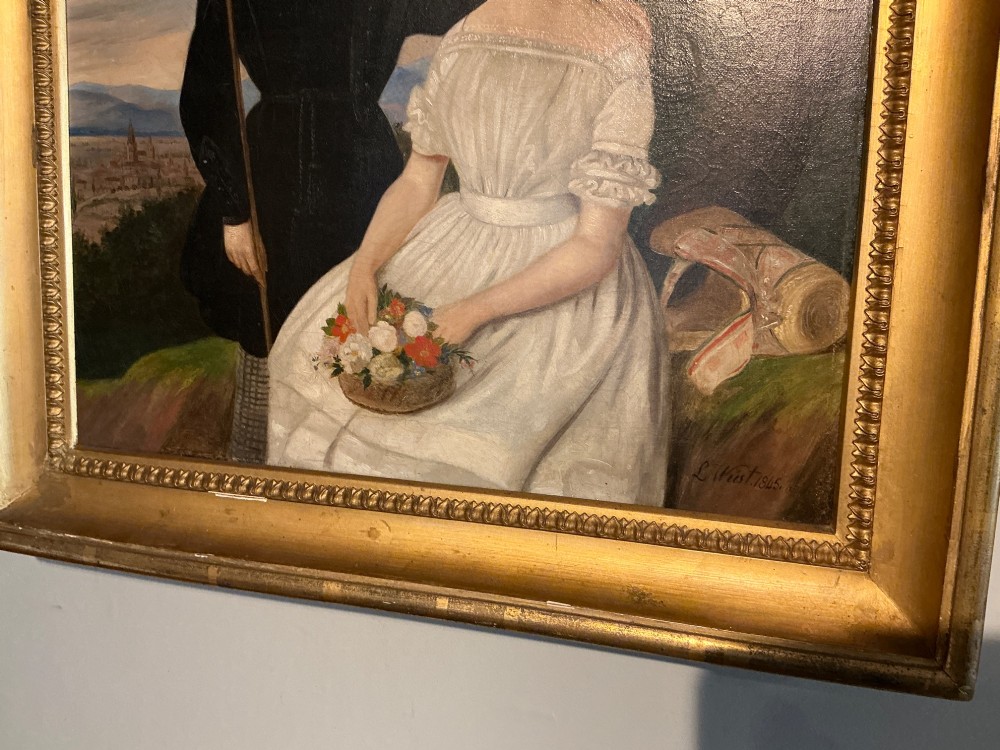 An early 19th-century oil painting depicting a boy in black clothing and a girl in a white dress seated outdoors, set within a gilded moulded frame. View IV