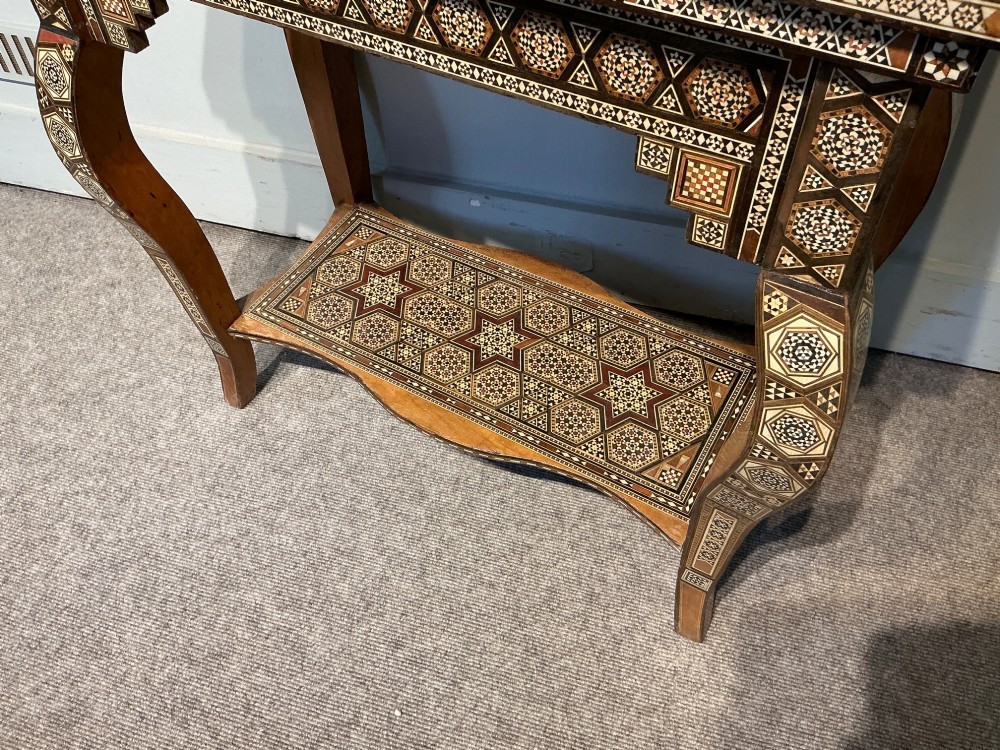 An antique Syrian Damascus games table featuring intricate geometric mother-of-pearl and wood inlay with cabriole legs and a matching lower shelf. View IV