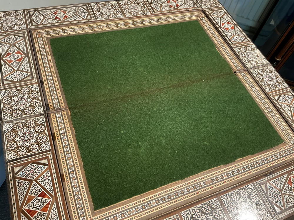 An antique Syrian Damascus games table featuring intricate geometric mother-of-pearl and wood inlay with cabriole legs and a matching lower shelf. View XII
