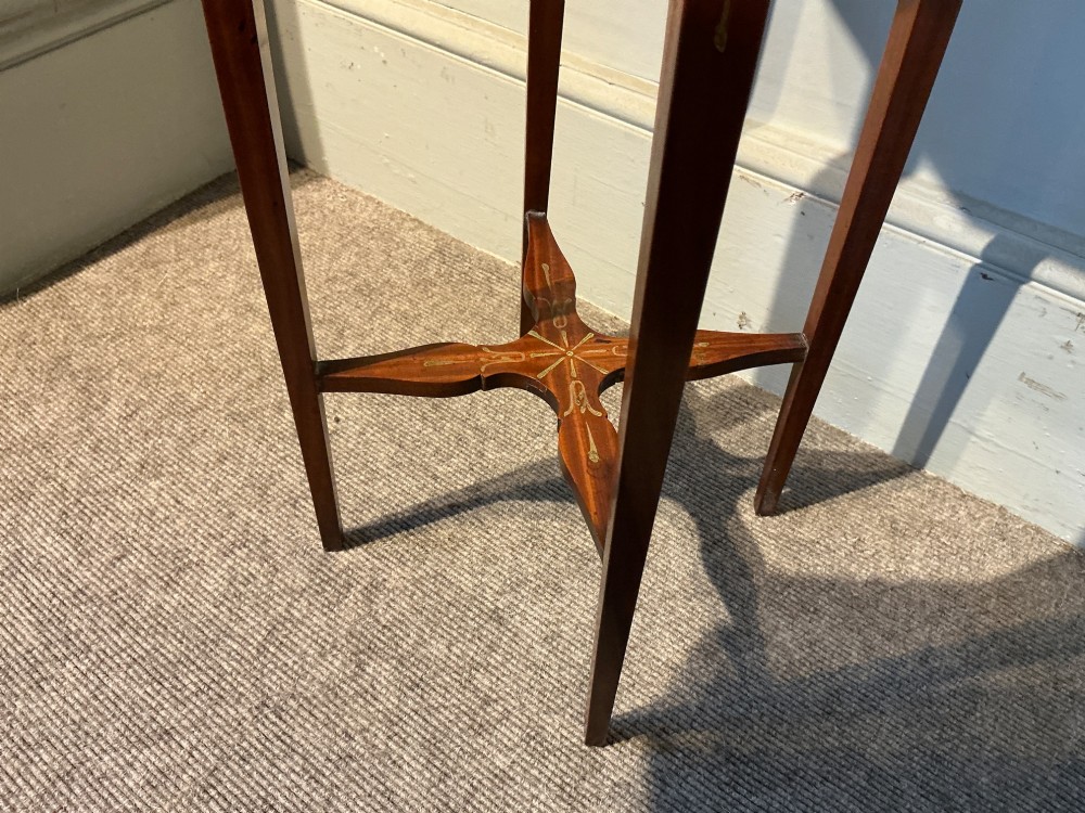 An octagonal antique satinwood urn stand featuring hand-painted floral garlands, a pull-out slide, slender tapered legs, and an X-shaped cross stretcher. View VI