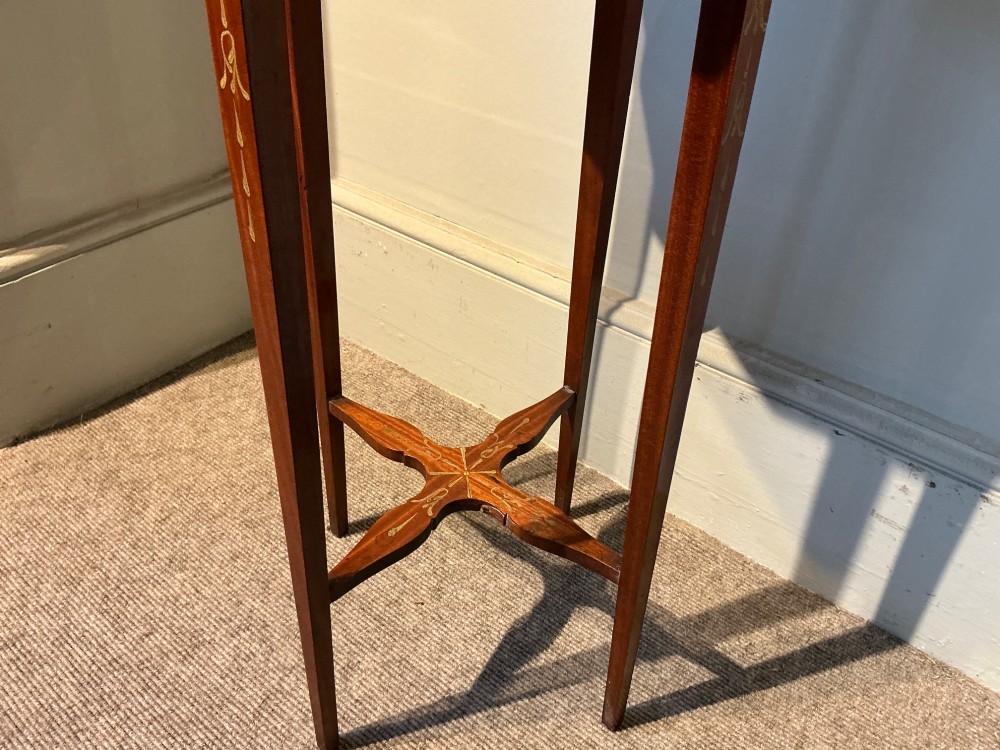 An octagonal antique satinwood urn stand featuring hand-painted floral garlands, a pull-out slide, slender tapered legs, and an X-shaped cross stretcher. View VIII
