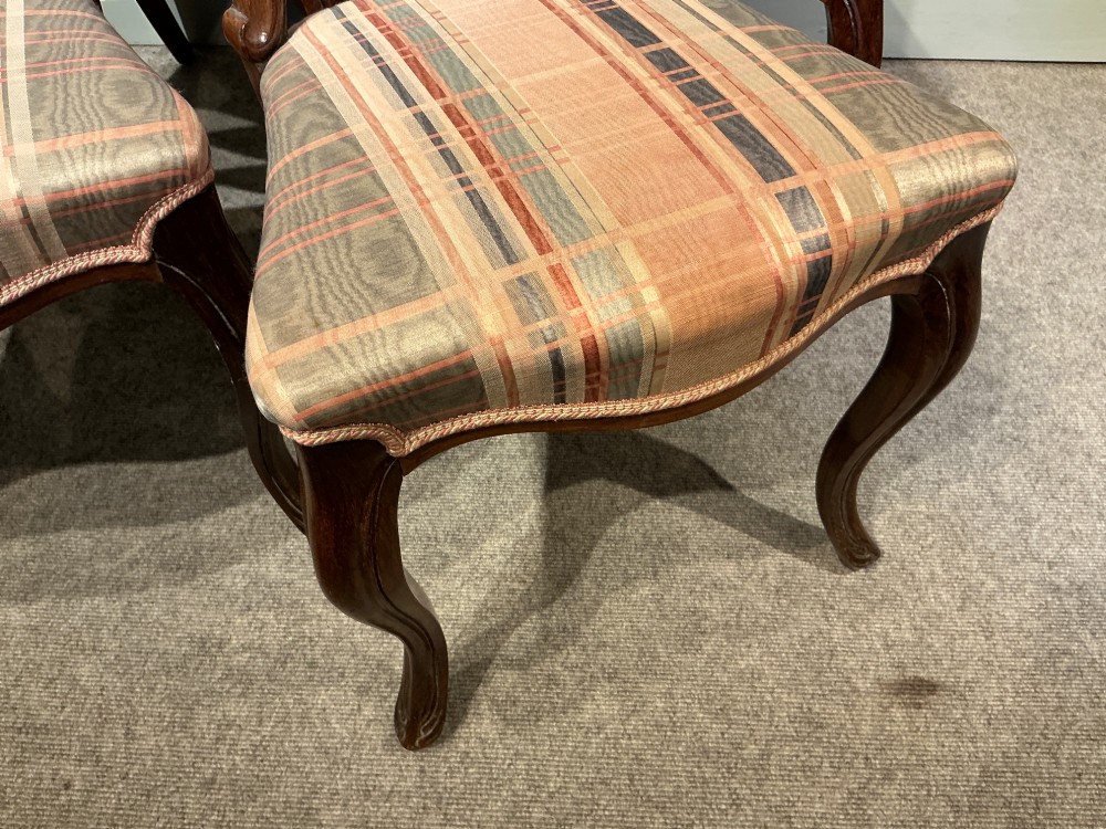 A set of six early Victorian balloon back dining chairs crafted from dark polished wood with striped upholstery. View V
