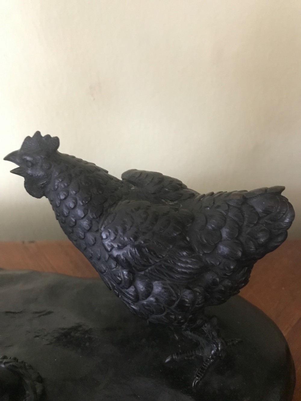 A dark bronze Japanese okimono sculpture depicting a boy in traditional kimono and geta sandals walking beside a chicken on a cast naturalistic base. View VI