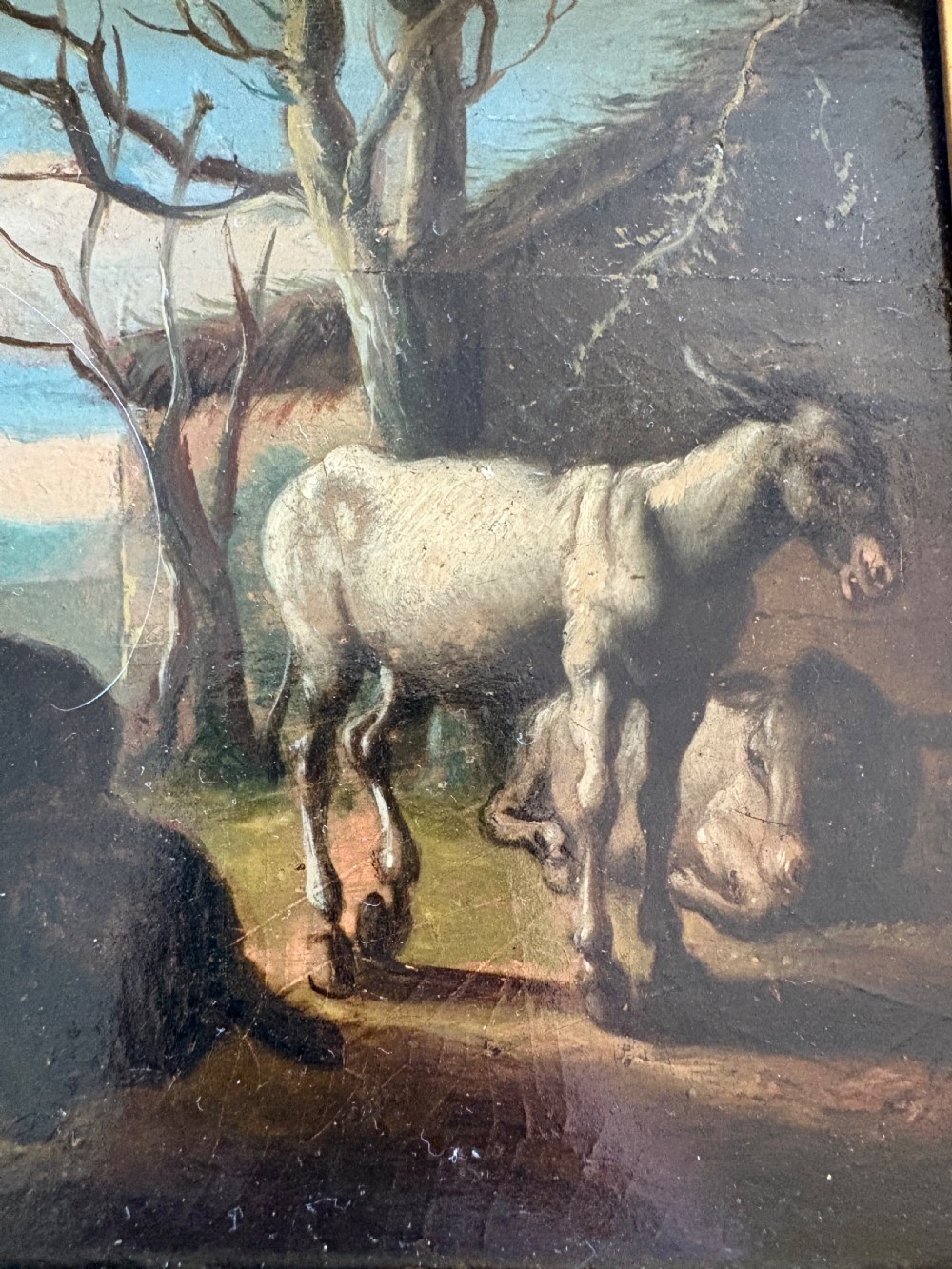 An eighteenth-century style pastoral oil painting on an oak panel featuring a shepherd and farm animals set within a carved giltwood frame. View III