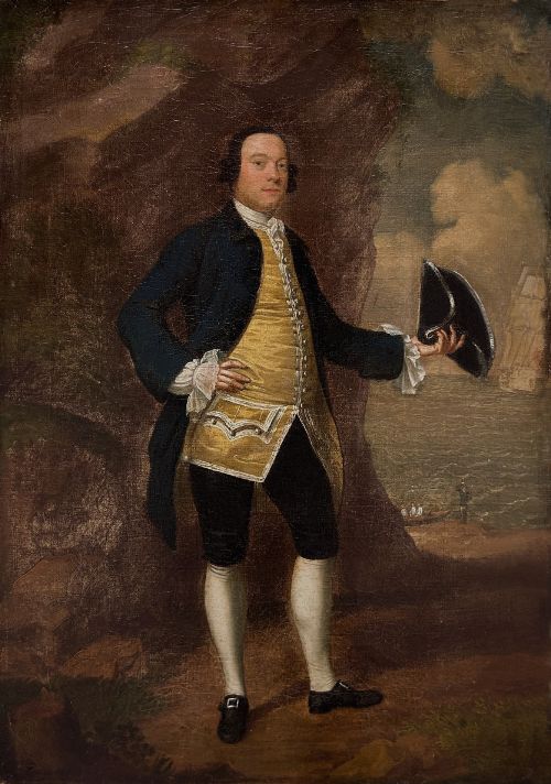fig 1. An 18th-century oil portrait of a gentleman in a blue coat and gold waistcoat holding a tricorn hat, framed in a carved giltwood frame.
