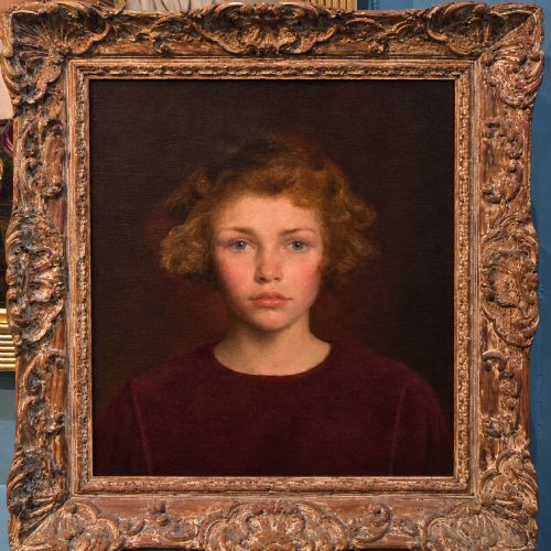 fig 1. An oil painting on canvas depicting a young girl with short curly auburn hair and blue eyes wearing a dark red garment against a warm brown background.
