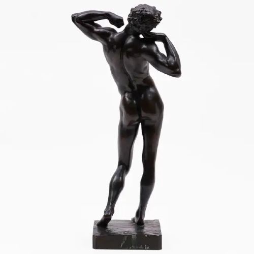 fig 2. A dark patinated bronze sculpture depicting a standing male nude figure stretching upwards with bent arms on a rectangular bronze base.