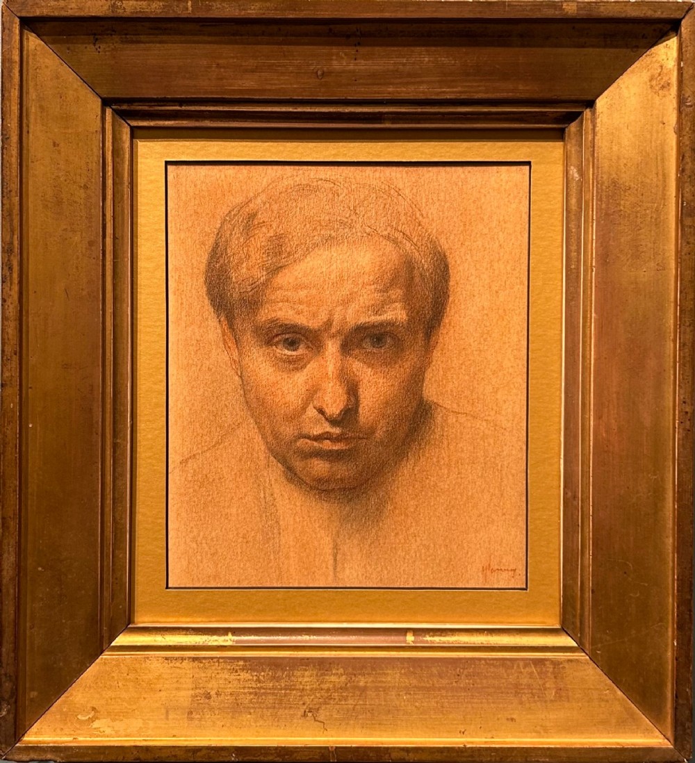 A monochrome warm brown chalk and charcoal self-portrait study depicting a mans face looking directly forward on textured paper. View II