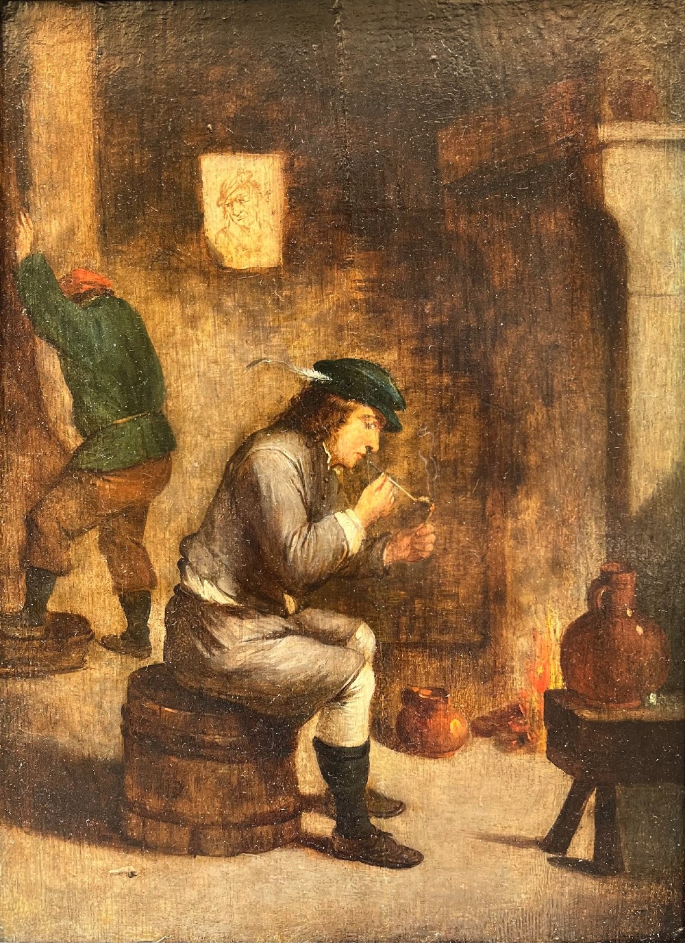 An oil painting depicting a seated man in a feathered cap lighting a pipe beside a fire, with a barrel beneath him and another figure standing in the background.
