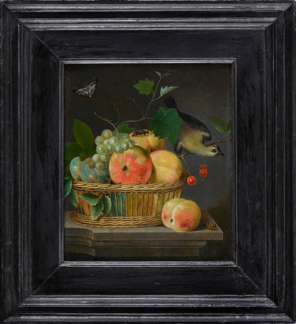 A seventeenth-century style Flemish oil painting depicting a basket of peaches and grapes alongside a bird and butterfly, set within a wide ebonised wooden frame.