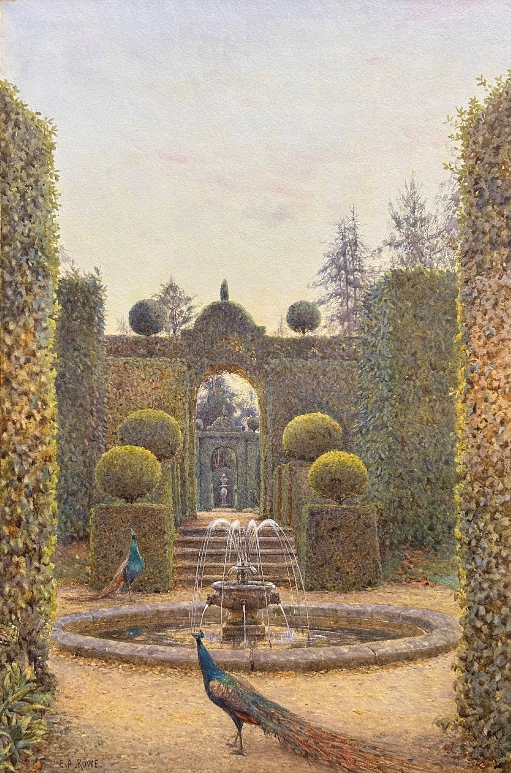 A framed watercolour painting depicting a formal garden with manicured topiary, a central stone fountain, and peacocks, set within a wide gold mount and dark wood frame. View II