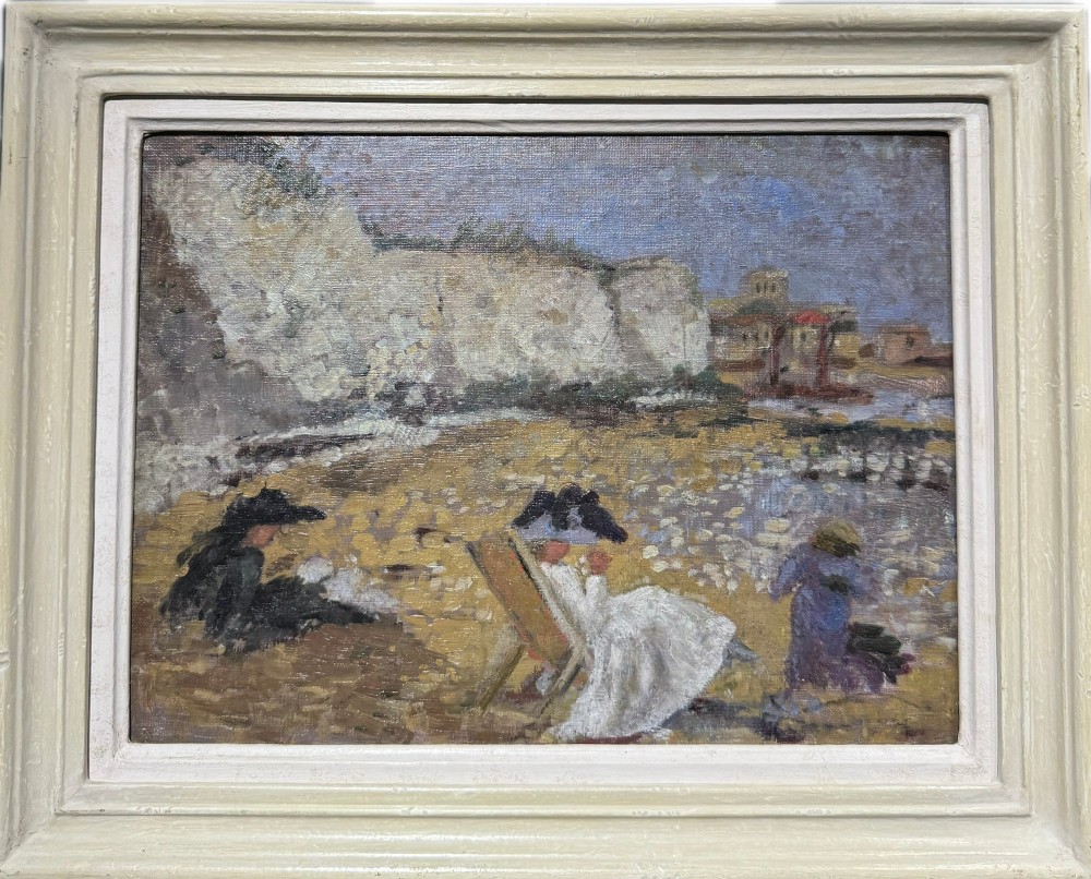 A framed Post-Impressionist oil painting depicting three figures resting on a sandy shore beneath white chalk cliffs, presented in a painted off-white stepped frame.