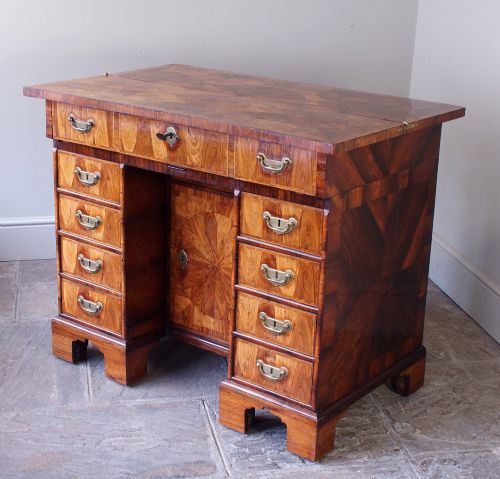 A William and Mary Kingwood Oyster Veneered Kneehole Secretaire Desk