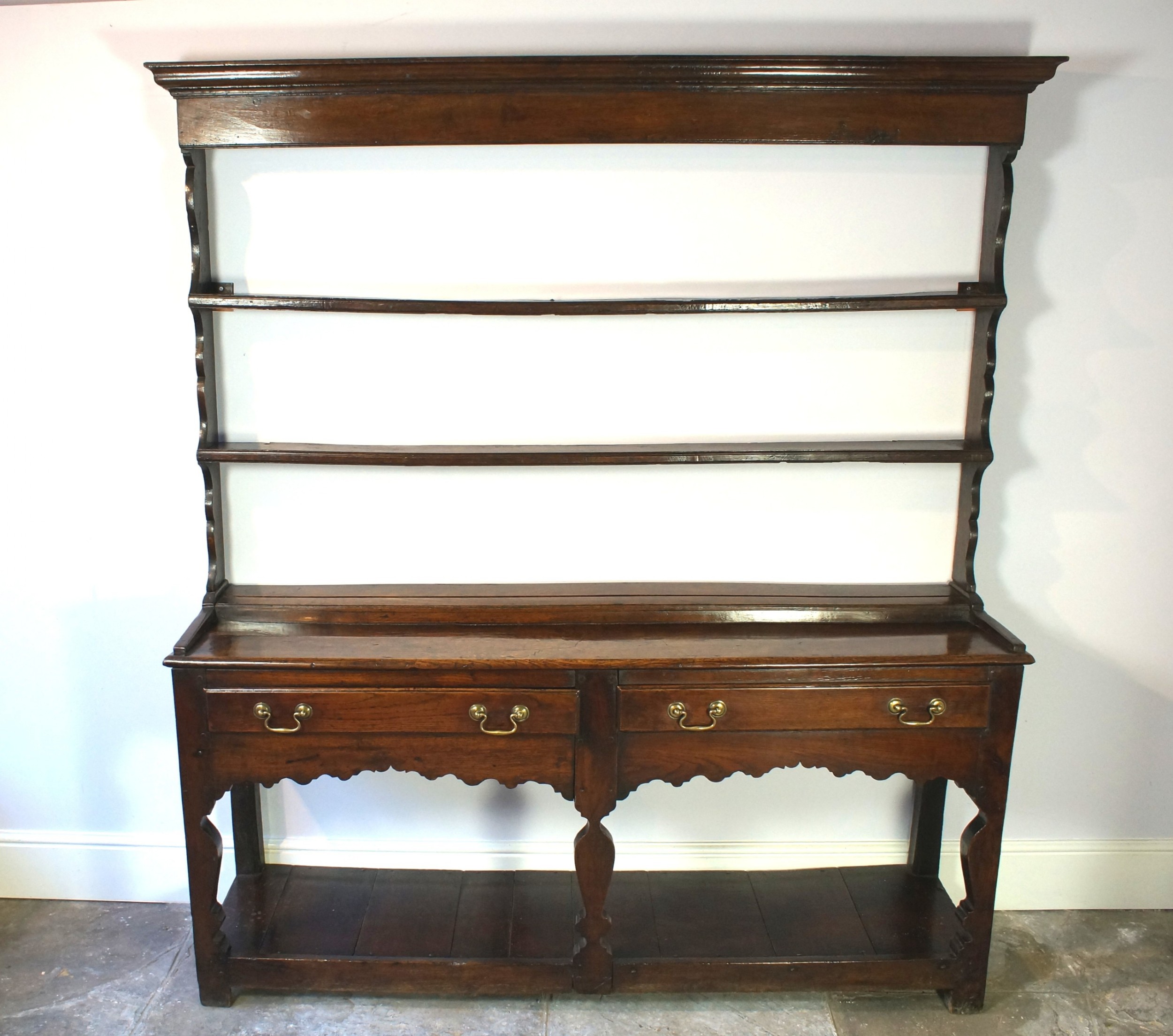 18th century silhouette legged oak dresser and rack