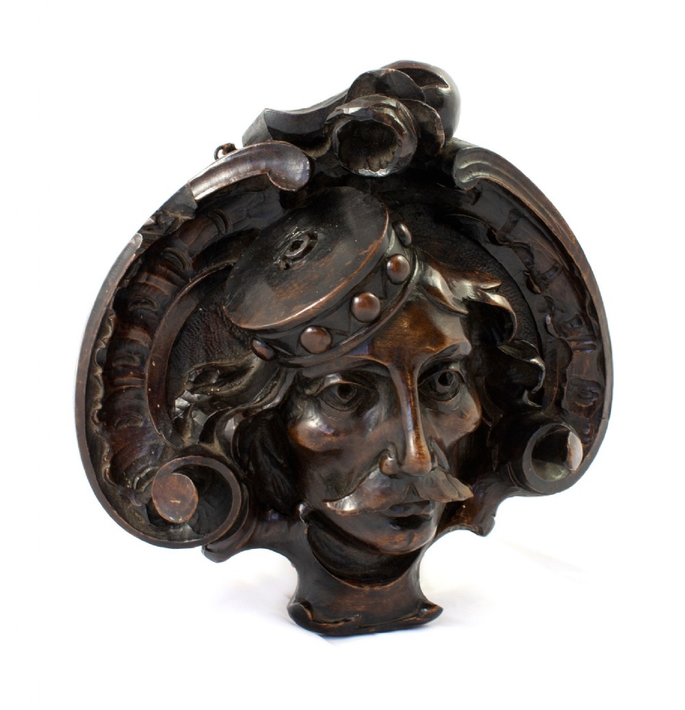 Four finely carved 19th century theatre masks