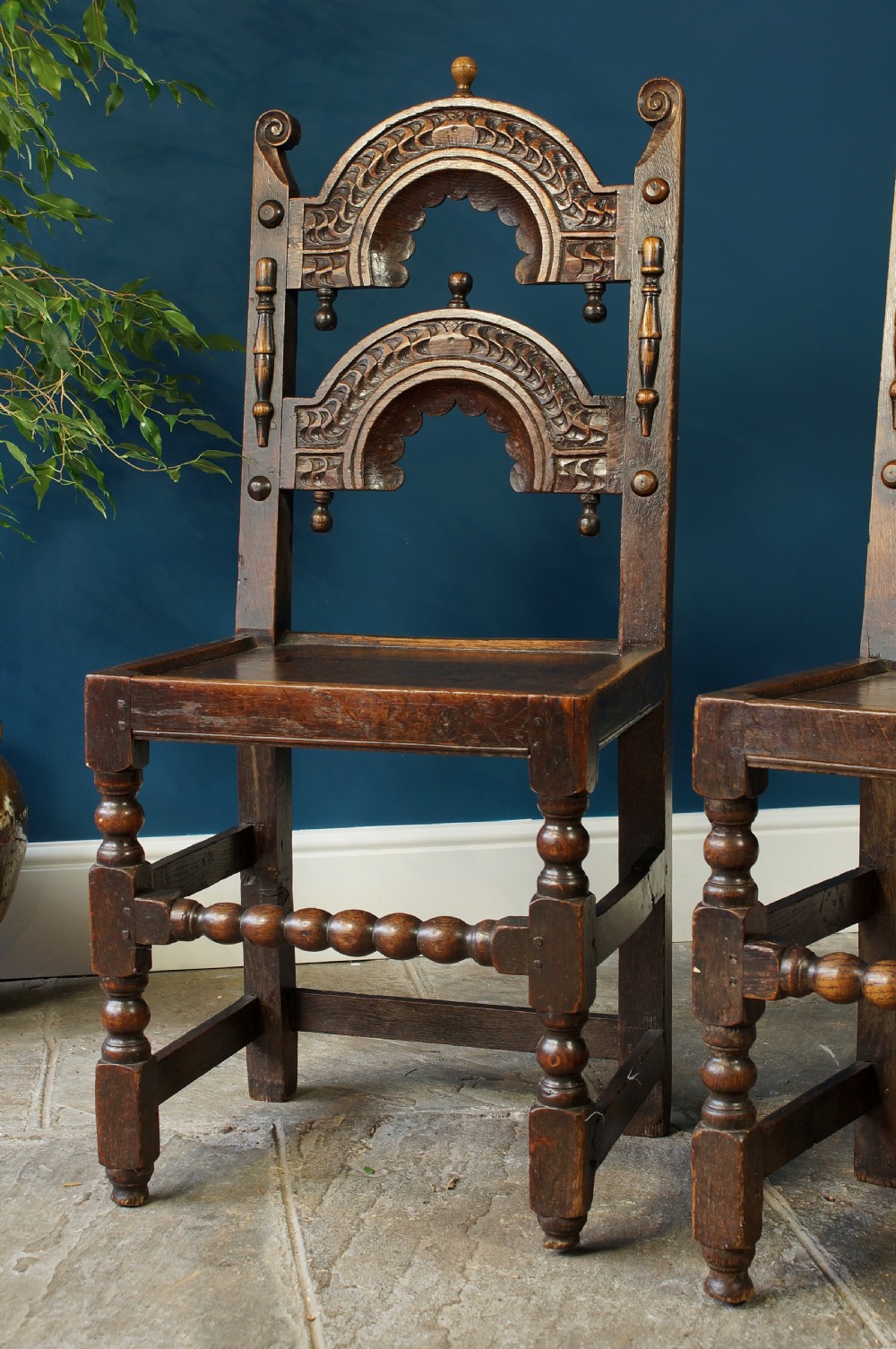 A pair of 17th century oak backstools View II