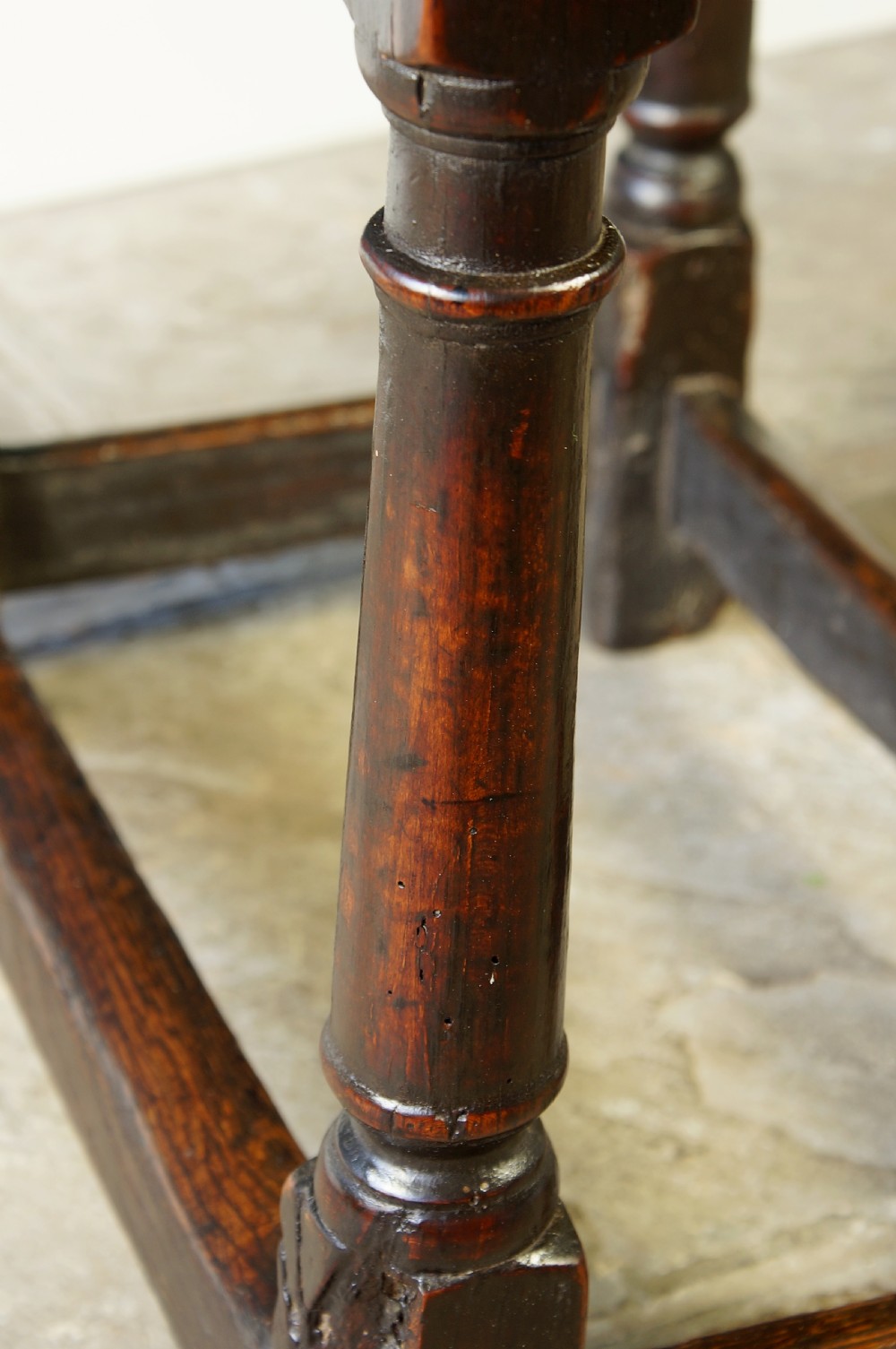A 17th Century Oak and Fruitwood joint stool View II
