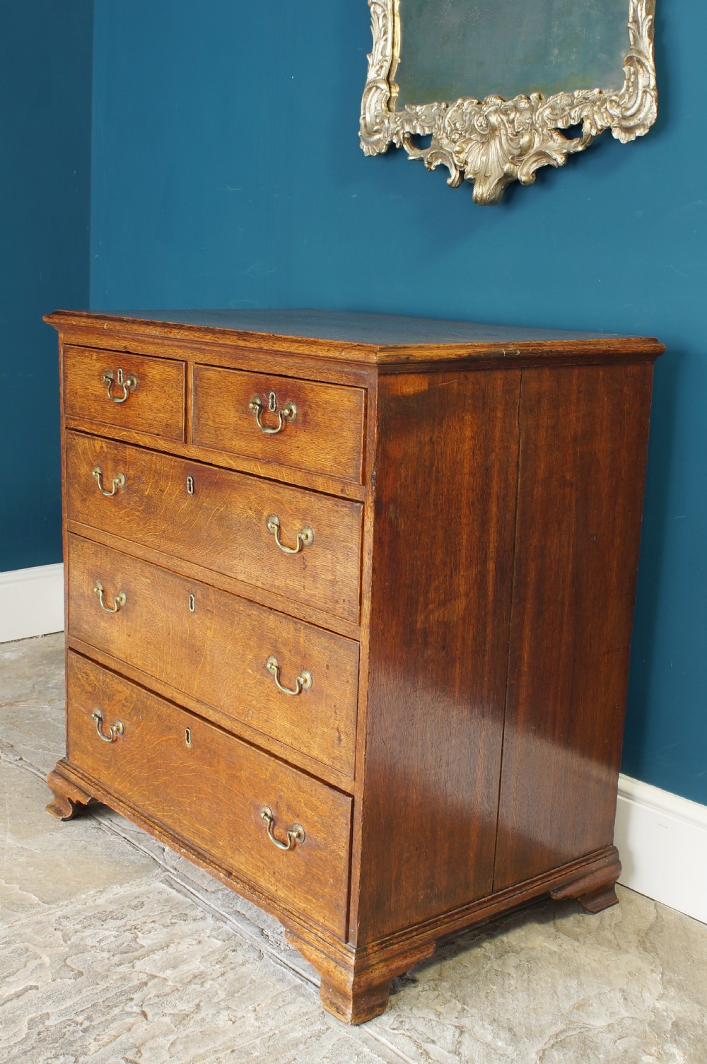 A small Georgian Oak chest of drawers.