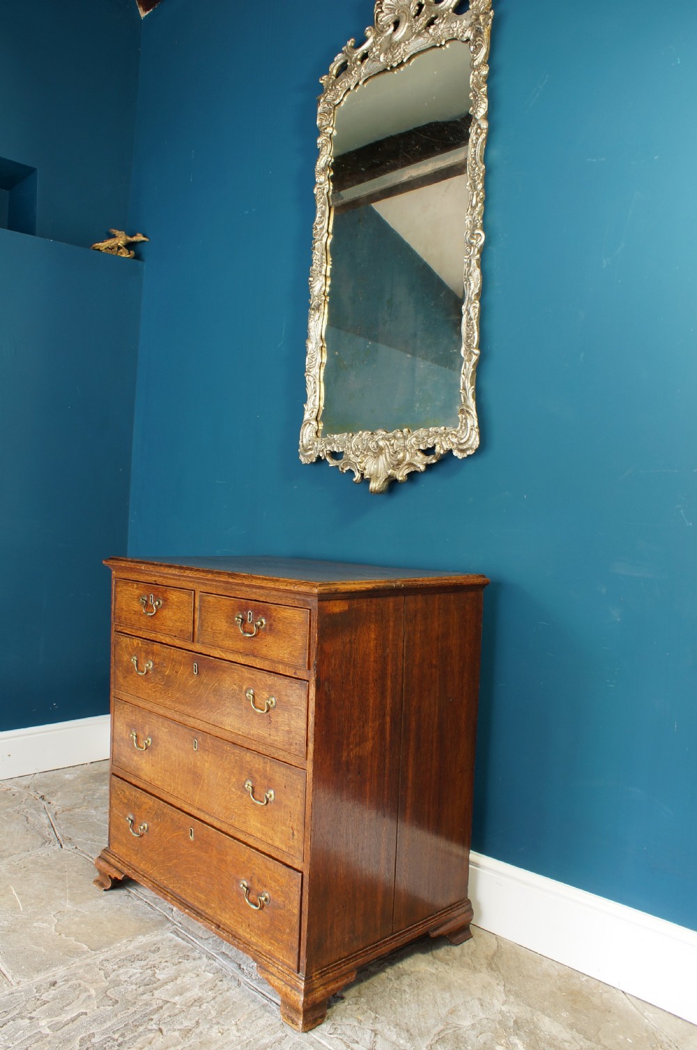 A small Georgian Oak chest of drawers. View II