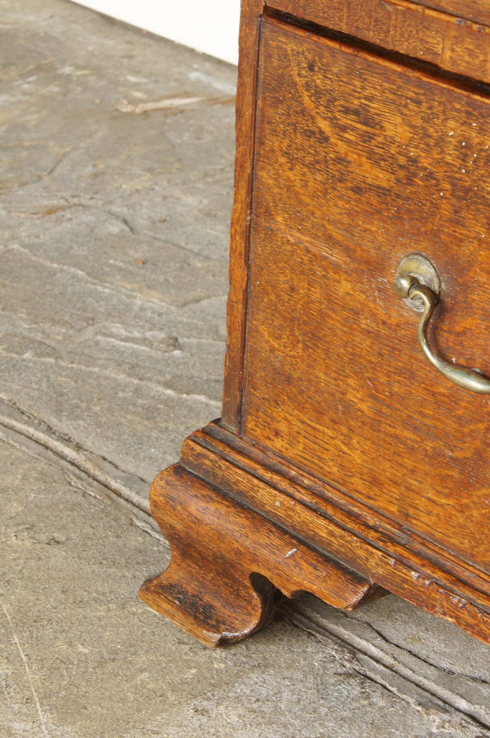 A small Georgian Oak chest of drawers. View IV