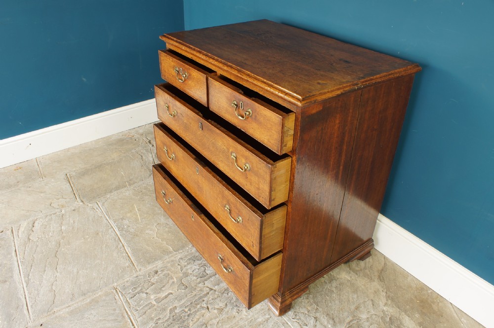 A small Georgian Oak chest of drawers. View VIII
