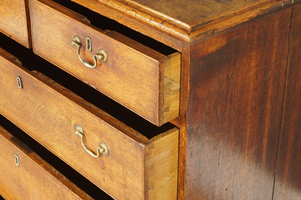 A small Georgian Oak chest of drawers. View IX