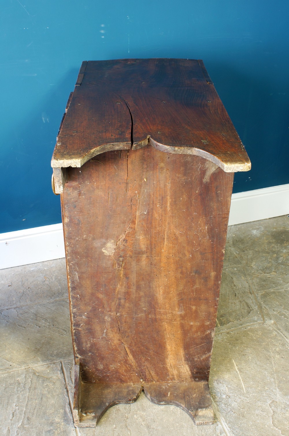 A Georgian elm mule chest featuring a hinged top lid over two wide drawers with brass swan-neck handles. View XVI