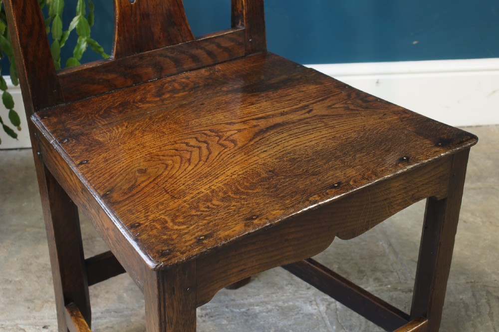 A set of four Georgian oak dinning chairs. View II