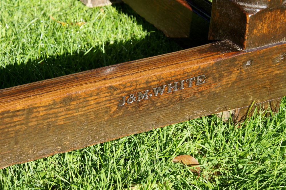 A large 17th-century oak refectory dining table with a long plank top, six turned legs, and robust perimeter stretchers. View IX