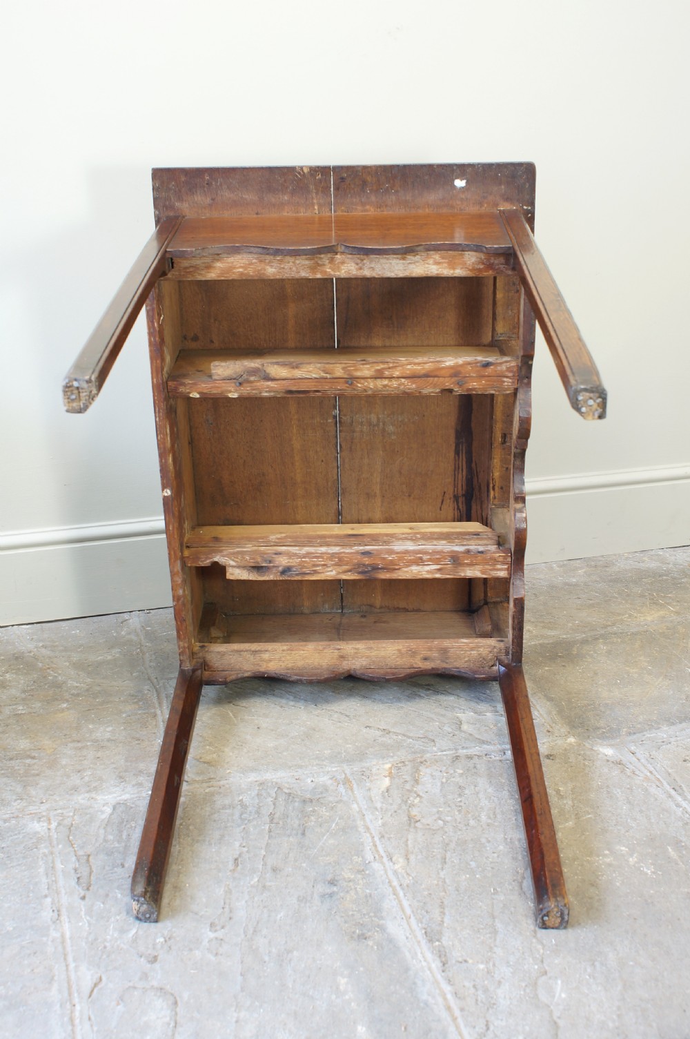 A George III oak lowboy side table featuring three drawers with brass swan-neck handles, a shaped apron, and four square legs. View VI