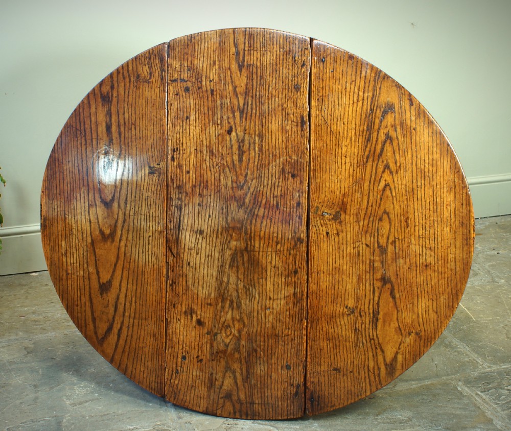 A small 17th-century oak gateleg table with two drop leaves, turned legs, and lower box stretchers. View VI