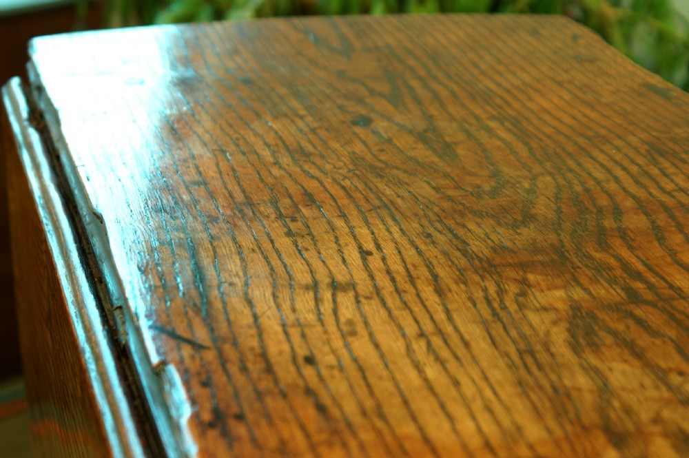 A small 17th-century oak gateleg table with two drop leaves, turned legs, and lower box stretchers. View VII