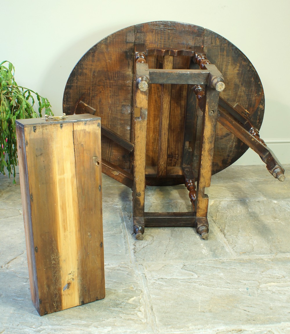 A small 17th-century oak gateleg table with two drop leaves, turned legs, and lower box stretchers. View XI