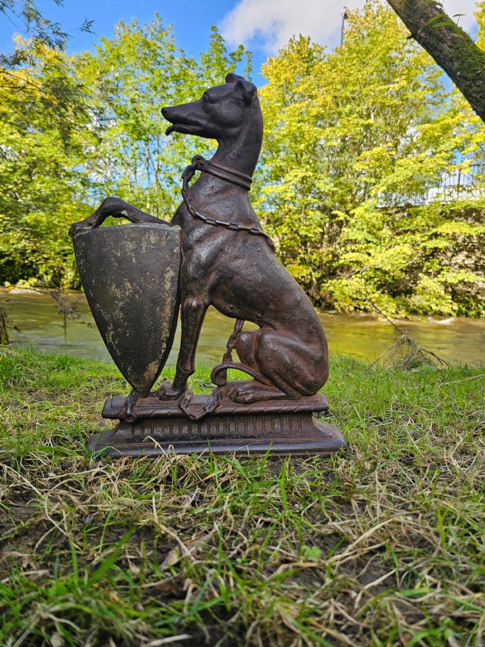A country house cast iron armorial doorstop