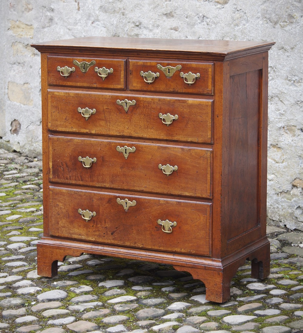 A Small Early Georgian Solid Walnut Chest Of Drawers. View II