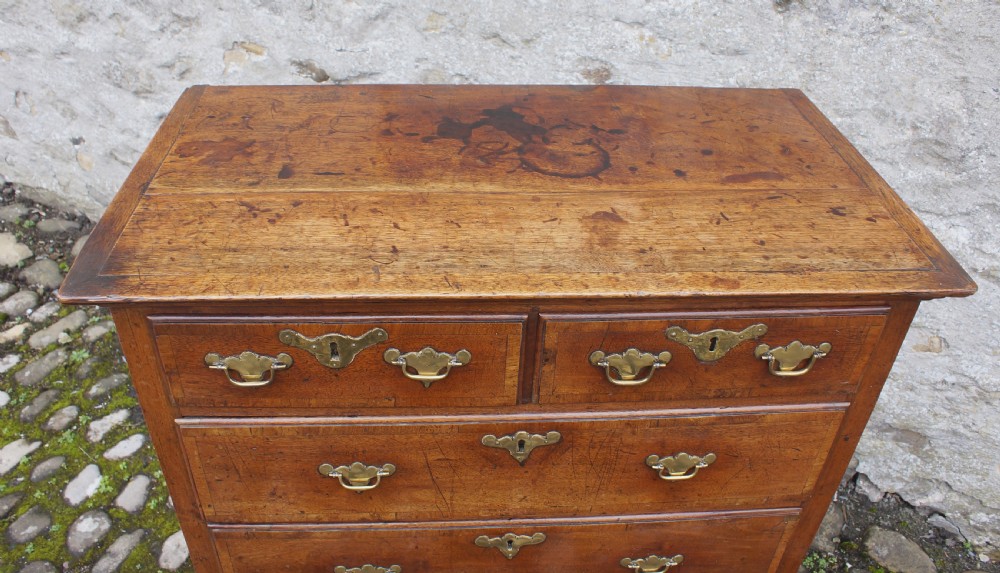 A Small Early Georgian Solid Walnut Chest Of Drawers. View III
