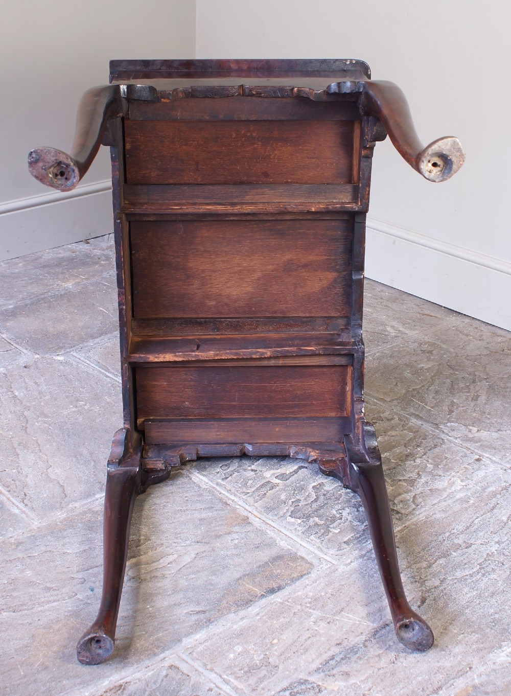 A mid-18th century George II mahogany lowboy featuring three drawers with brass handles, a shaped apron, and four cabriole legs ending in pad feet. View IX