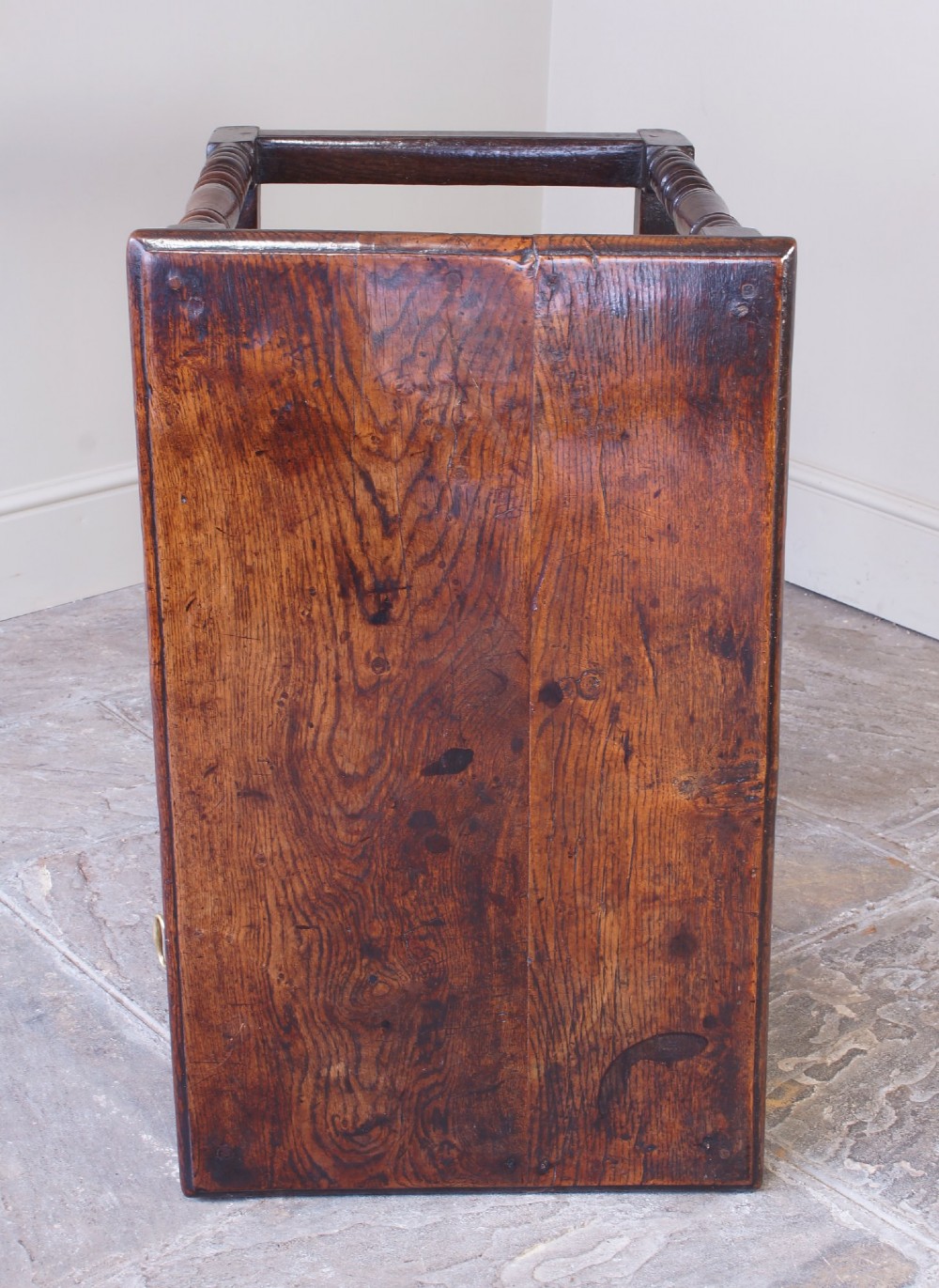 A late 17th-century dark oak side table featuring a single drawer with brass handles, turned legs, and a rectangular stretcher base. View IX