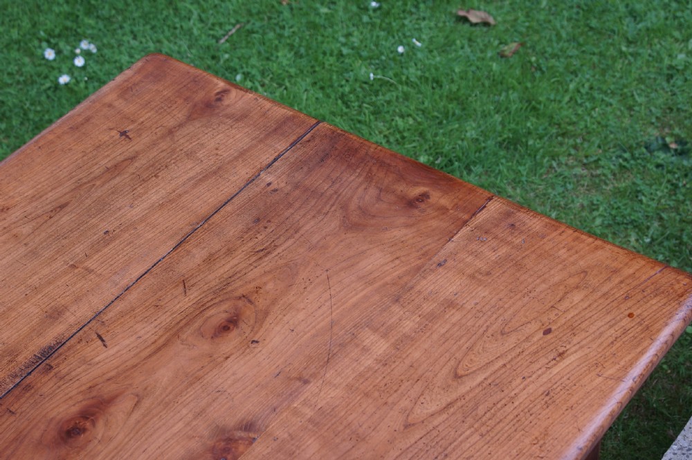 A rectangular 19th-century French cherry wood dining table featuring a plank top, straight legs, and lower H-stretchers. View III