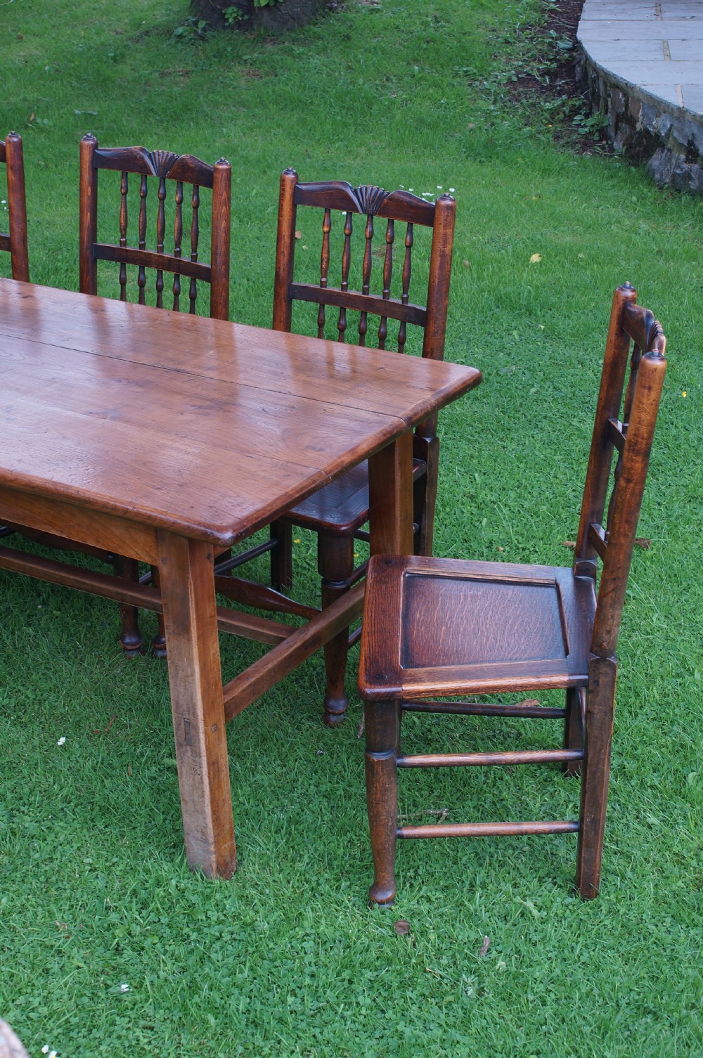 A rectangular 19th-century French cherry wood dining table featuring a plank top, straight legs, and lower H-stretchers. View VI