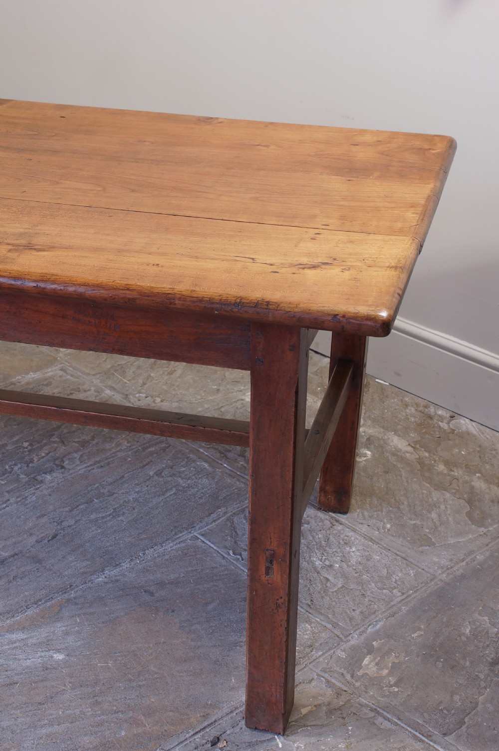 A rectangular 19th-century French cherry wood dining table featuring a plank top, straight legs, and lower H-stretchers. View VII