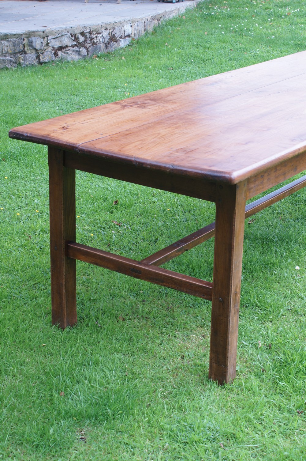 A rectangular 19th-century French cherry wood dining table featuring a plank top, straight legs, and lower H-stretchers. View VIII
