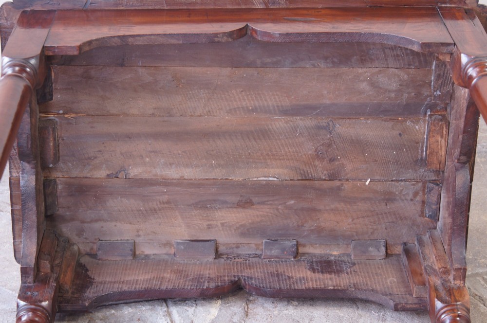 An early 18th-century fruitwood centre table featuring a rectangular plank top, a scalloped apron, and slender turned legs ending in pad feet. View XIII