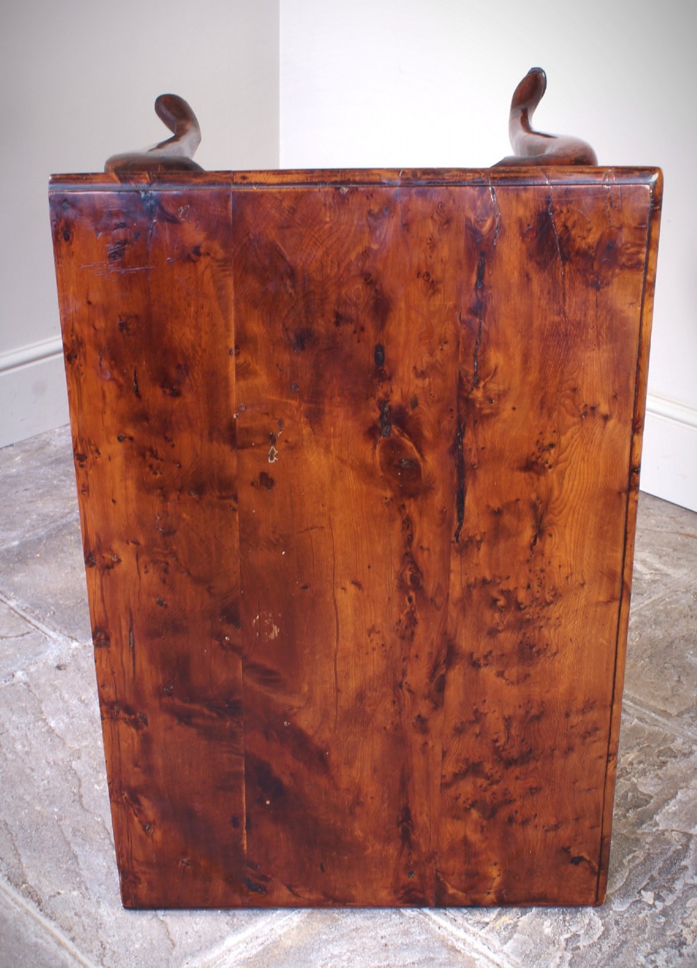 An 18th-century yew wood lowboy table featuring three drawers, a shaped scalloped apron, metal knob handles, and cabriole legs. View IV