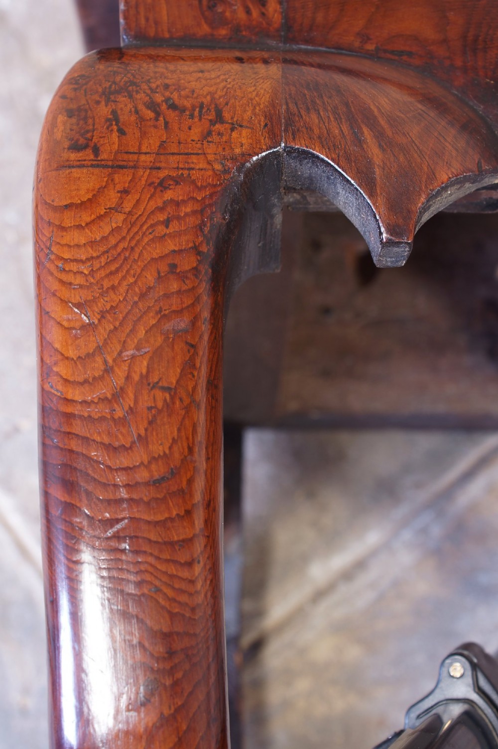 An 18th-century yew wood lowboy table featuring three drawers, a shaped scalloped apron, metal knob handles, and cabriole legs. View XIII