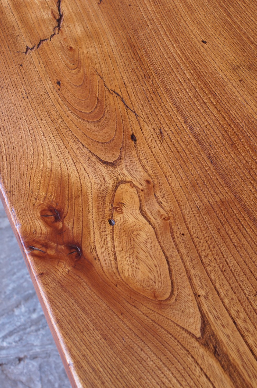 A long nineteenth-century elm farmhouse dining table with a thick plank top, straight legs, and side stretchers. View XIV
