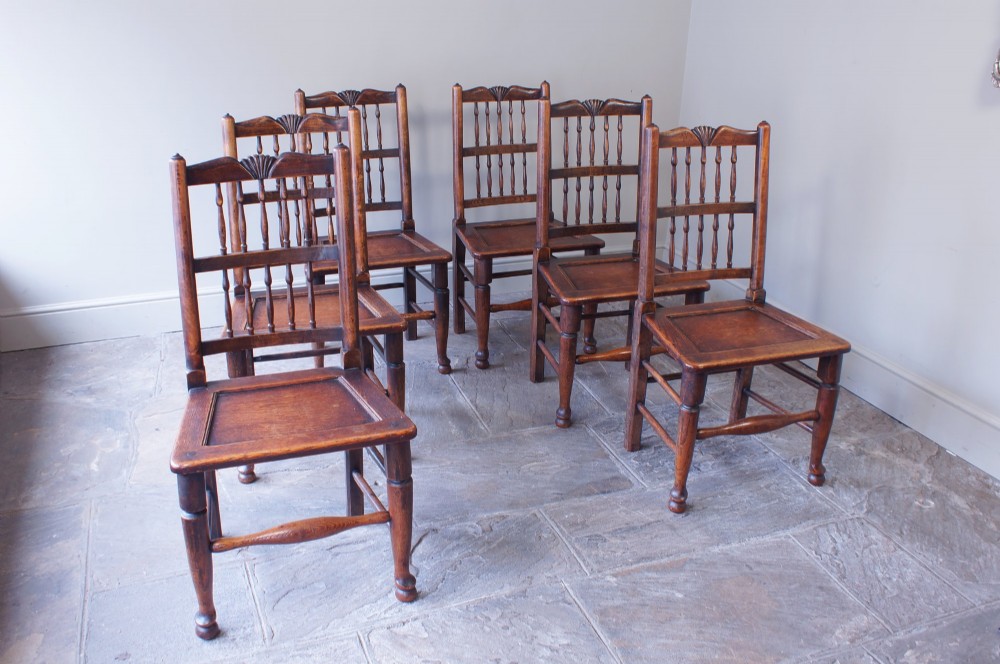 A long nineteenth-century elm farmhouse dining table with a thick plank top, straight legs, and side stretchers. View XV