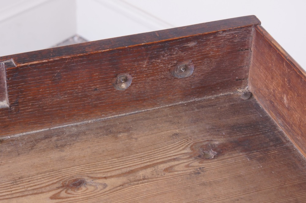 An 18th-century Georgian oak side table featuring a single drawer with decorative brass backplates and handles, set above a shaped apron and straight legs. View XIV