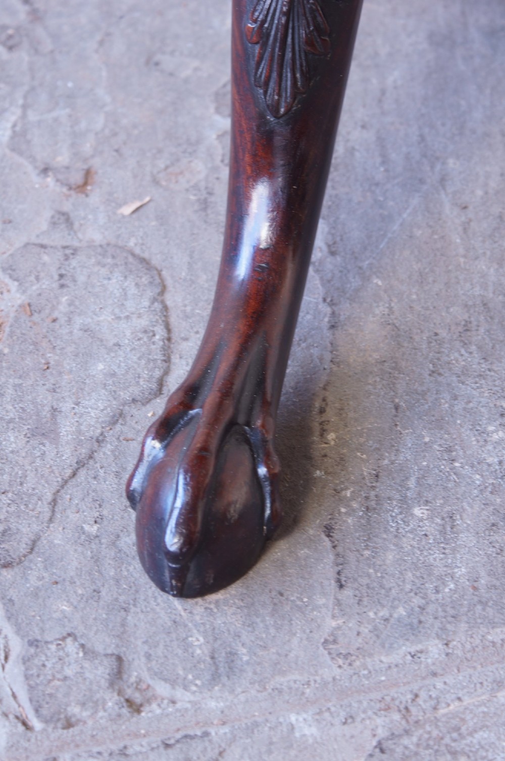 An 18th-century George III mahogany tripod table with a scalloped piecrust tilt-top, turned spiral column standard, and carved cabriole legs. View VII